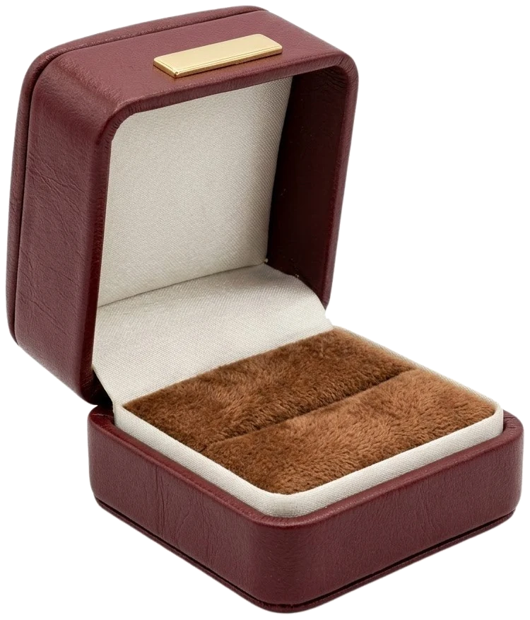 An open ring box in burgundy vegan leather lined with cream suede